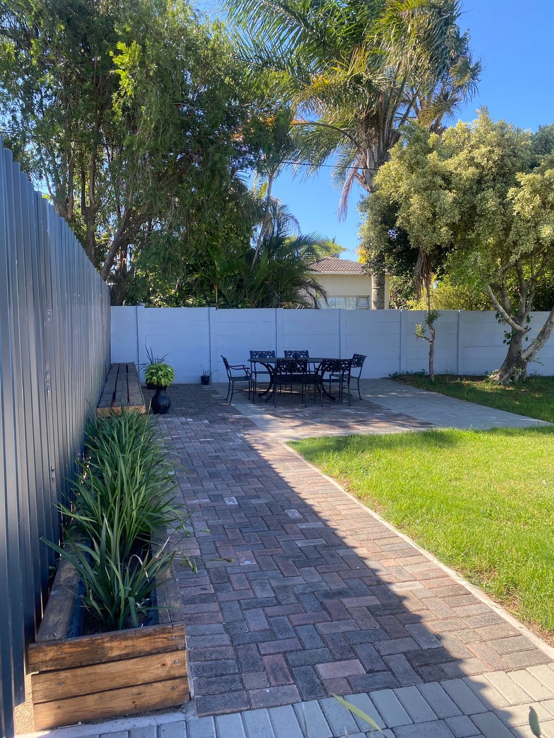 Outdoor seating and garden area at Fusion House