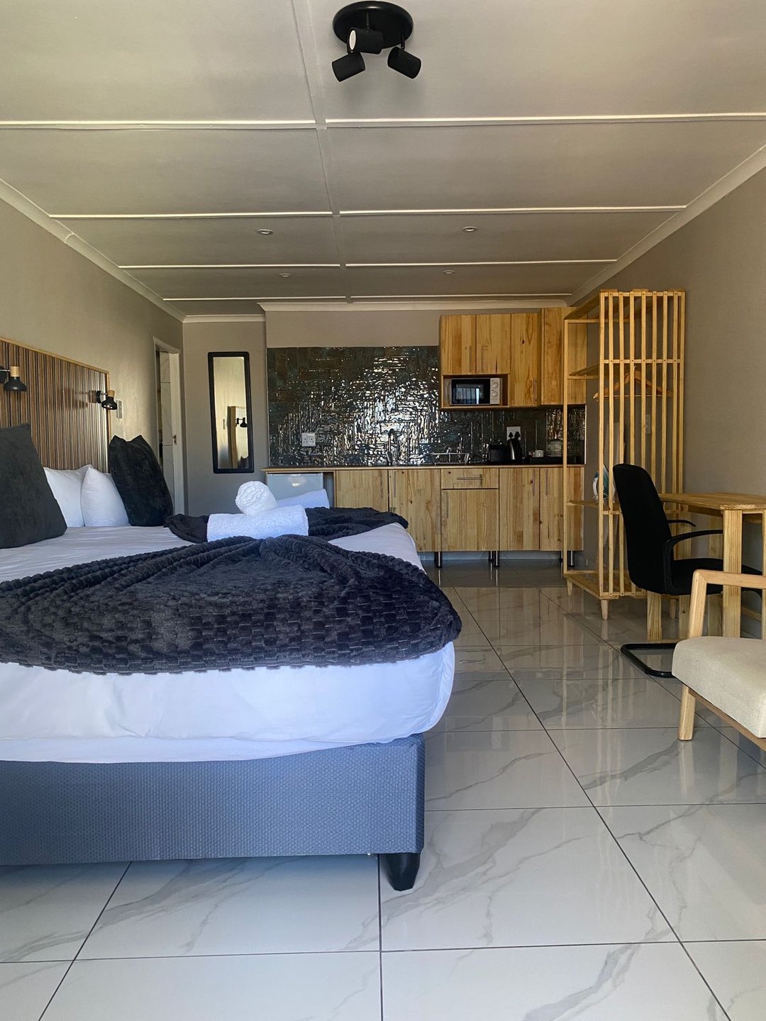 Self-catering Triple Room 8 with a king bed and single bed